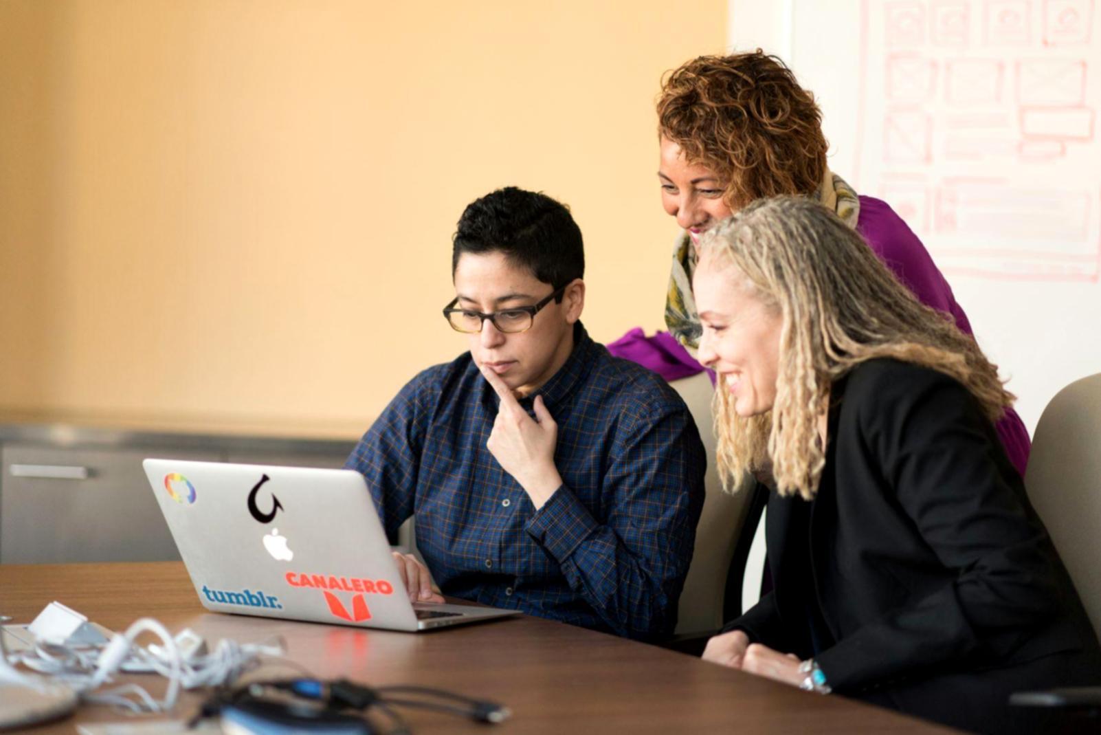 Students learning budgeting fundamentals in collaborative workspace